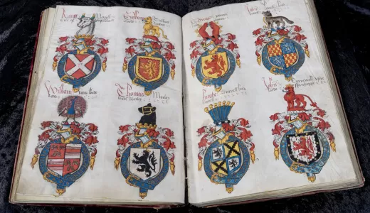 Armorial register of the Garter, opened to a two-page spread of arms designs