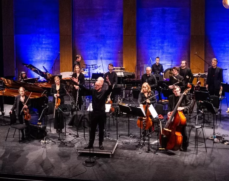 Ensemble music performers on concert stage