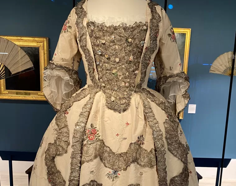 An 18th century sack-back silk gown on a mannequin
